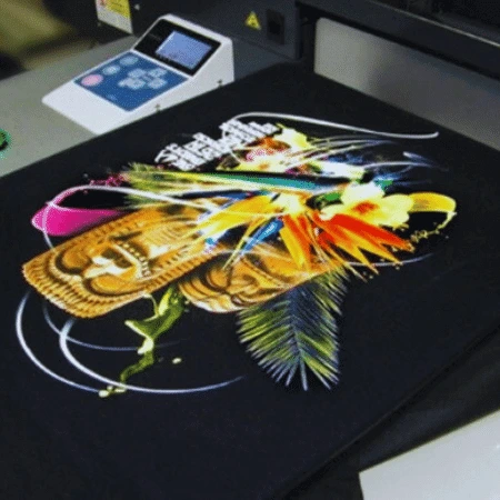 The Apparel Artist's direct-to-garment printing machine adding intricate details to a custom t-shirt design.