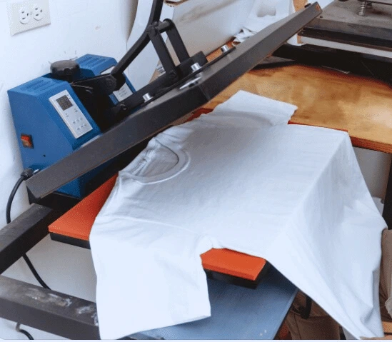 A close-up view of The Apparel Artist's basic sublimation printing process, showcasing a vibrant design being seamlessly integrated into a fabric.