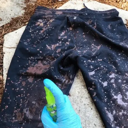 A close-up image of a garment featuring a trendy and eye-catching bleach wash, expertly crafted by The Apparel Artist.