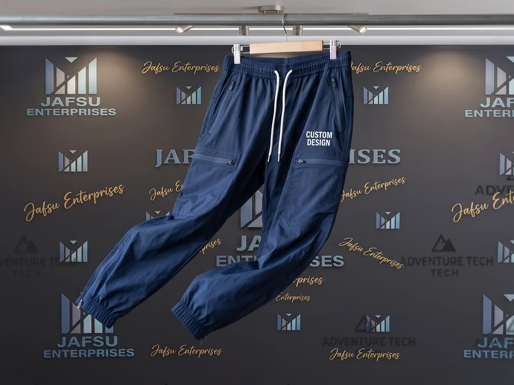 Lightweight nylon cargo wind pants with elastic hem and a CUSTOM DESIGN leg print