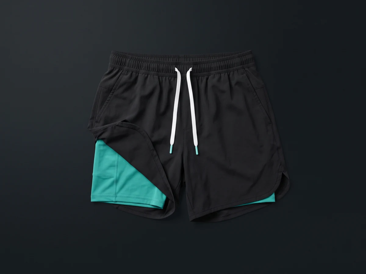 Custom gym shorts with a 2-in-1 compression liner, flat-lay — private label gym shorts by Jafsu Enterprises