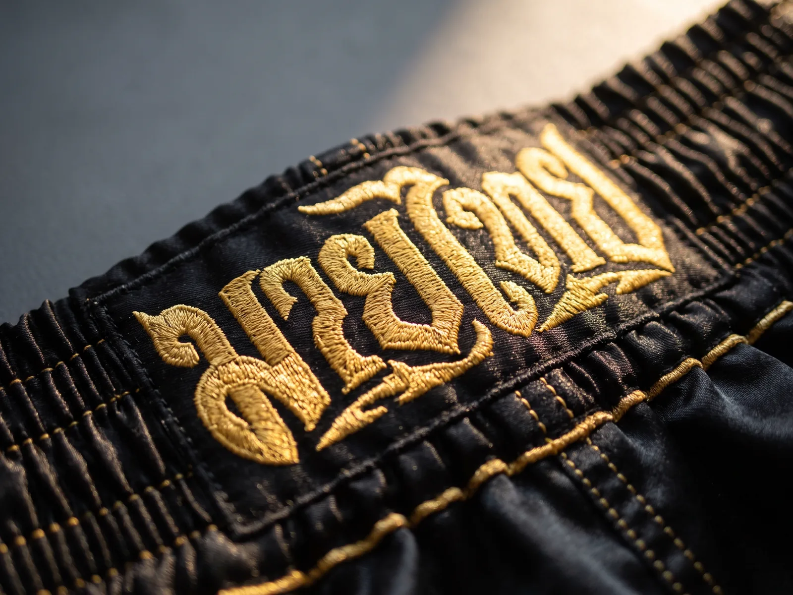 Embroidered waistband panel on a satin Muay Thai short made by Jafsu Enterprises