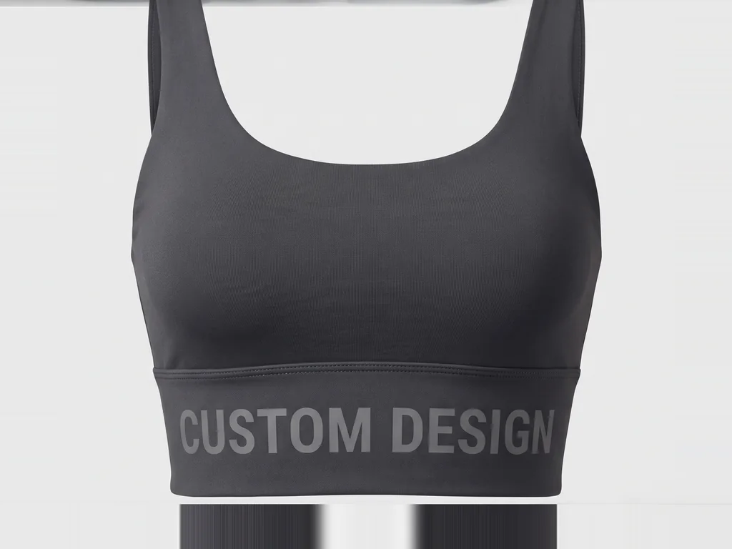 Longline crop sports bra in charcoal with a wide underband and CUSTOM DESIGN print, folded flat