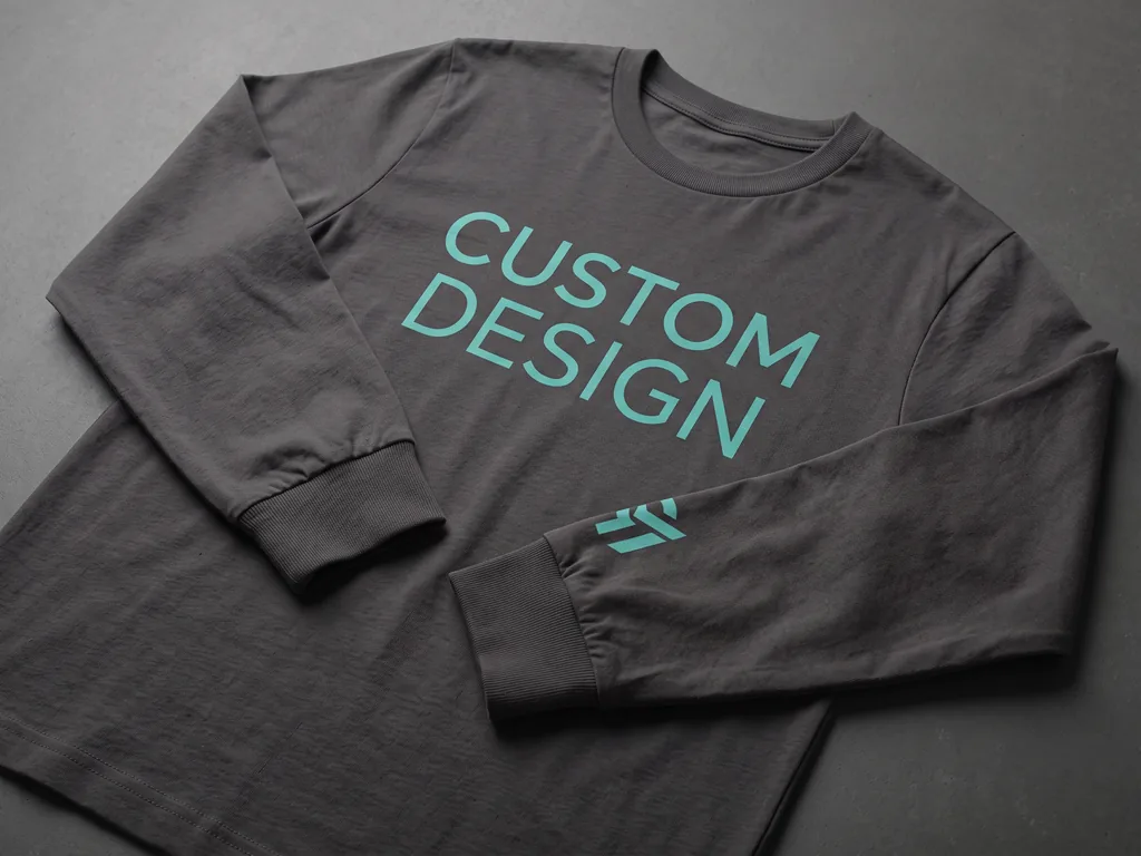 Charcoal long sleeve cotton t-shirt folded flat with ribbed cuffs, chest print and a sleeve print