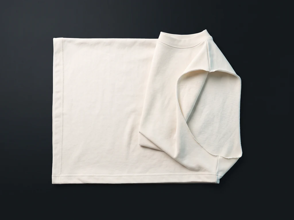 Oversized drop-armhole tank top in heavyweight off-white cotton jersey, folded flat